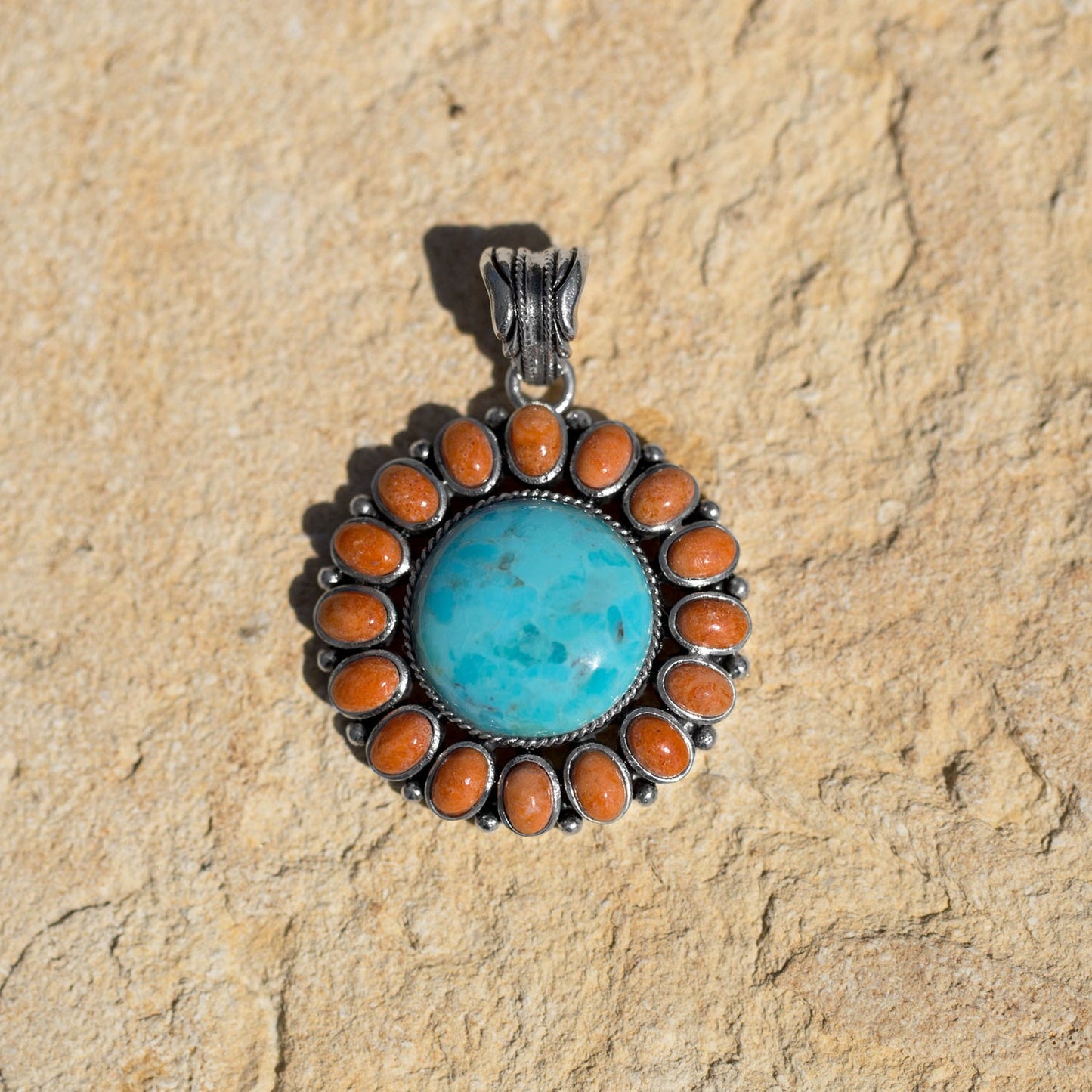 Turquoise and Coral Sunburst on a Sterling Silver Pendant