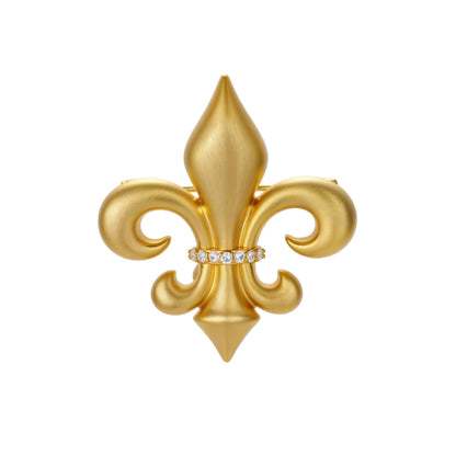 Ornate gold-plated fleur-de-lis brooch with crystal band detail on white background, showing brushed metal finish.